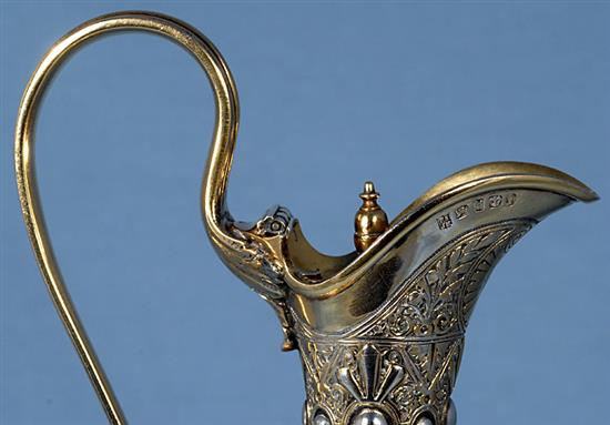 A mid Victorian parcel gilt silver ovoid shaped wine ewer/ claret jug, Height 13 ½”/340mm Weight 23.oz/653grms